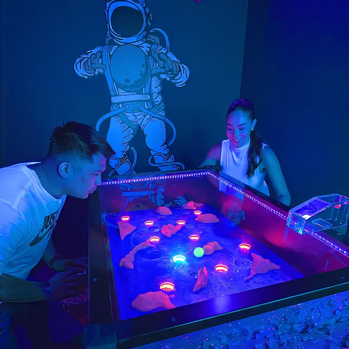 Two friends playing a challenge room together