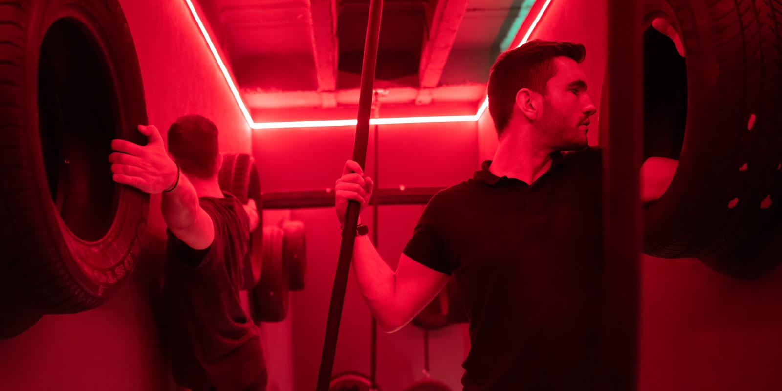 A player crossing the red-lit floor of the Restricted Area room